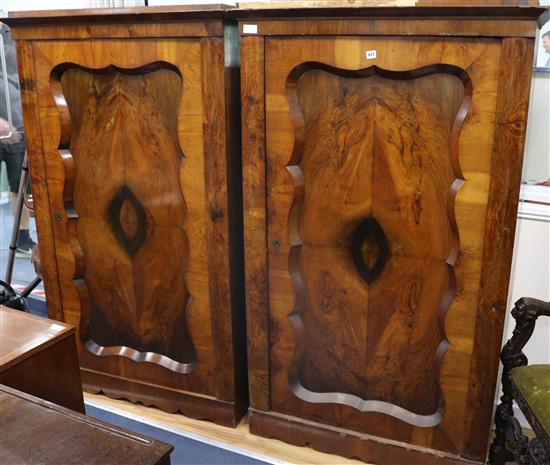 A pair of 19th century Continental walnut cupboards W.101cm